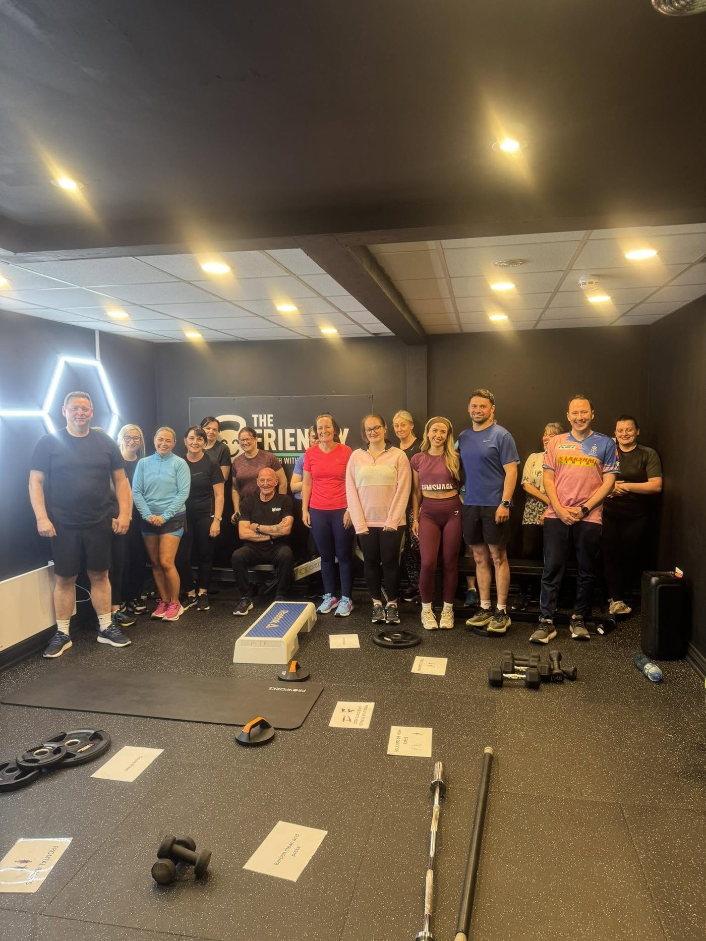 A smiling group of members after a class at The Friendly Gym
